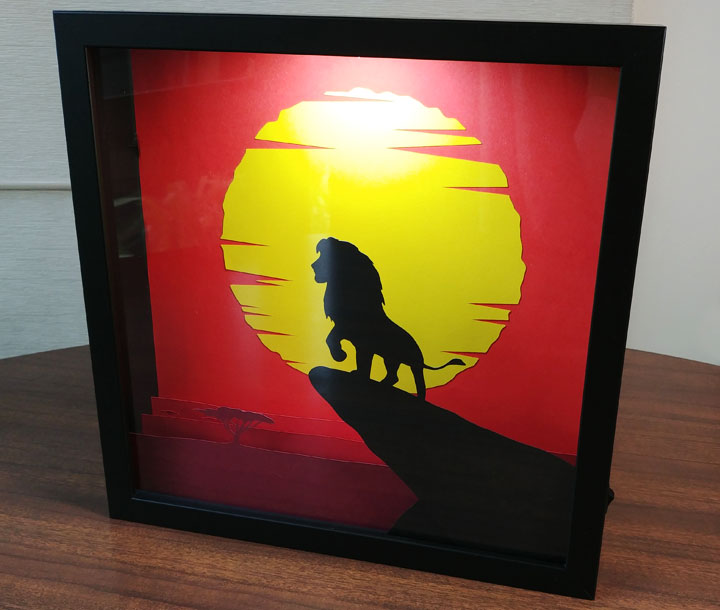 The completed light box with 5 layers depicting the Lion King movie poster