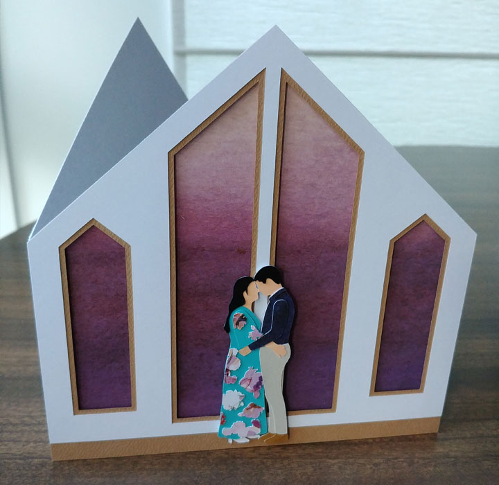 A 3D wedding card of a couple embracing in a chapel
